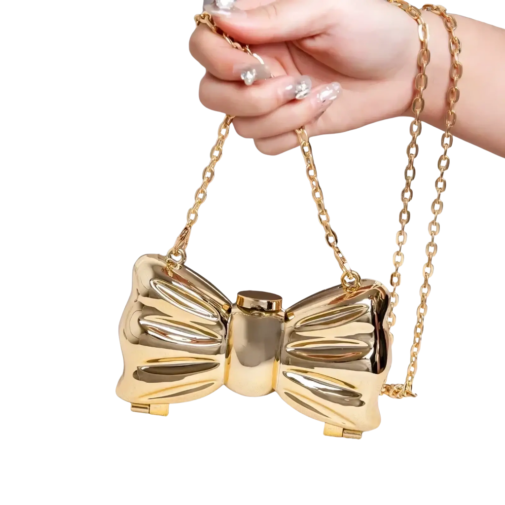 Gold metallic acrylic bow crossbody bag clutch with chain strap in metallic gold and silver finish