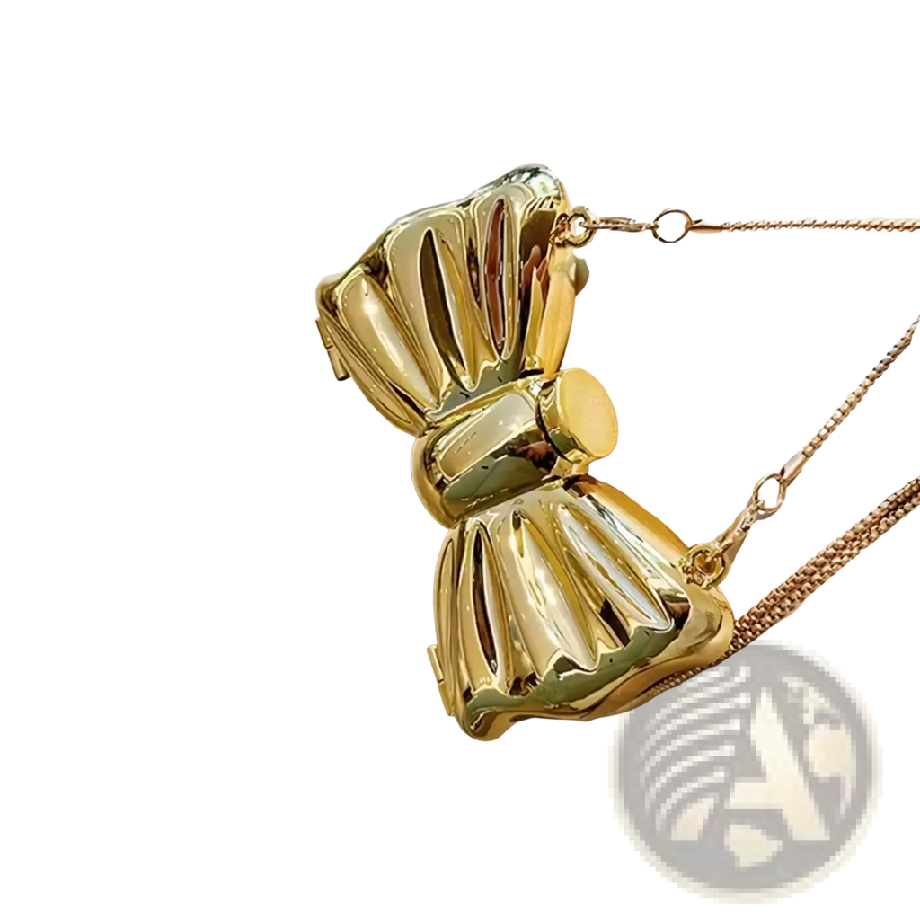 A shiny gold metallic acrylic bow crossbody bag clutch with a chain strap suitable for formal occasions
