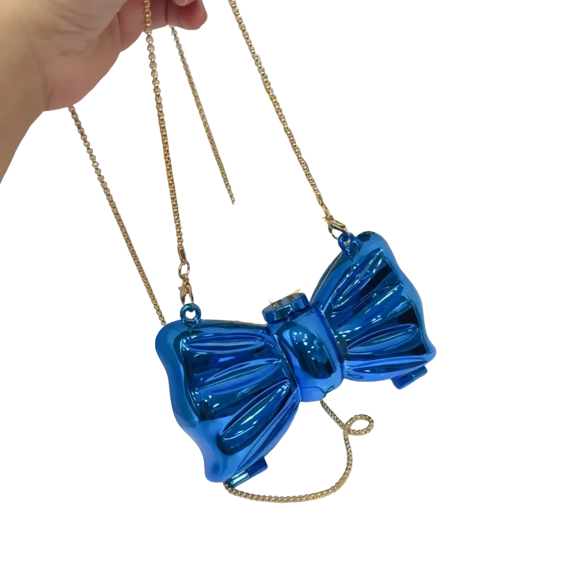 Vibrant blue metallic acrylic bow crossbody bag clutch with gold chain strap in a sleek bow shape