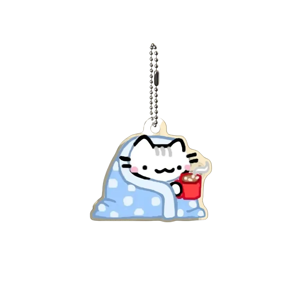 Acrylic cat keychain featuring a cute white cartoon cat with black whiskers holding a red mug wrapped in blue blanket