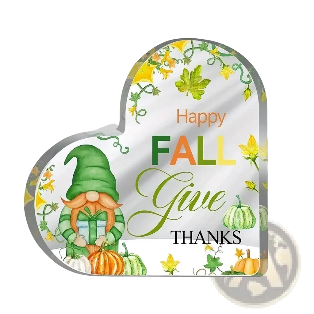 Acrylic christmas heart ornament desktop stand featuring a whimsical gnome with gifts surrounded by autumn leaves and pumpkins