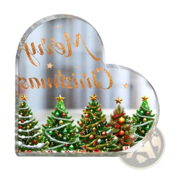 Heart-shaped transparent acrylic christmas ornament with glittery gold merry christmas script and decorated green trees