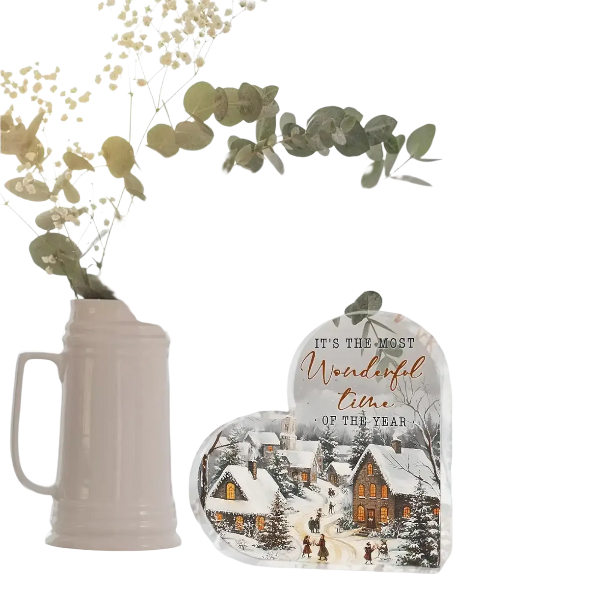 White ceramic beer mug vase with handle and eucalyptus branches as a festive christmas heart tabletop decoration
