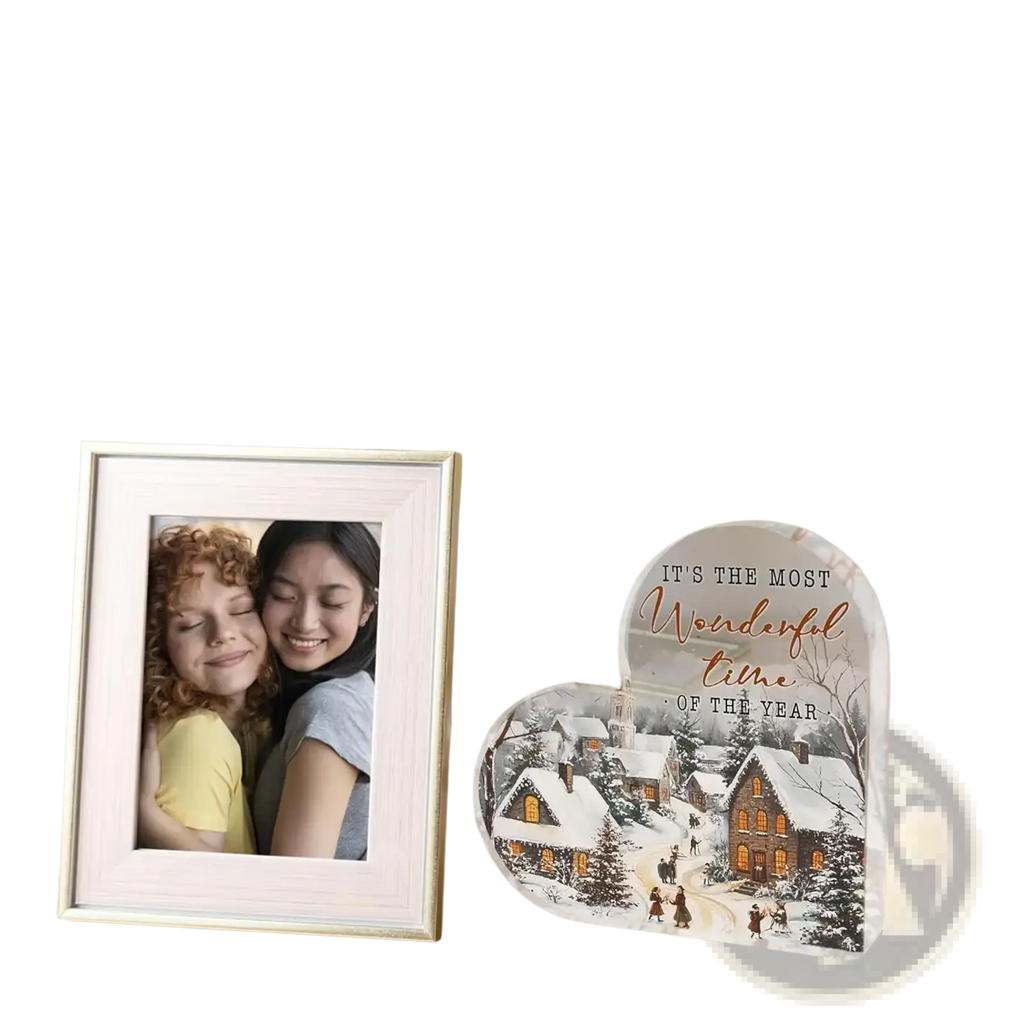Acrylic christmas heart tabletop decoration featuring a white framed photo of two smiling women in yellow and gray tops