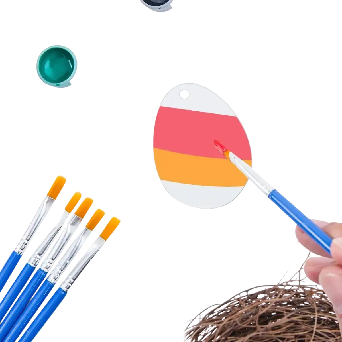 Acrylic easter egg blank being hand-painted with red and orange stripes on a white ceramic easter egg ornament