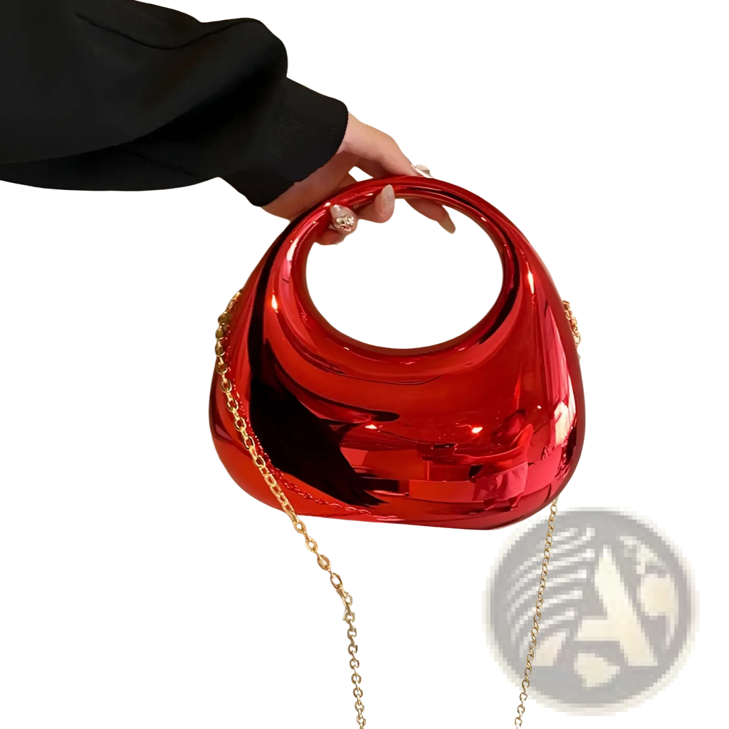 Vibrant red glossy acrylic resin handbag with gold chain strap and circular top handle metallic clutch bag