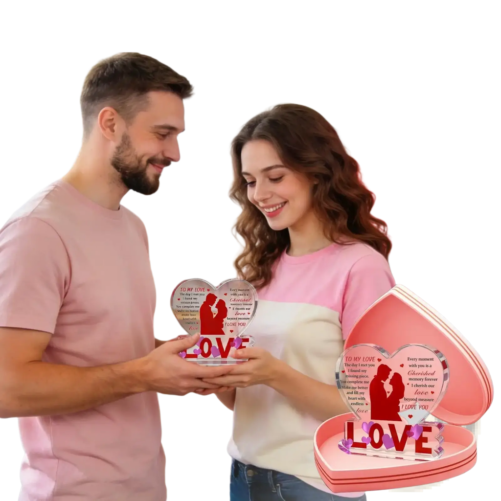 Pink heart-shaped acrylic keepsake box with clear insert showing red couple silhouette and bold love text for valentine gift
