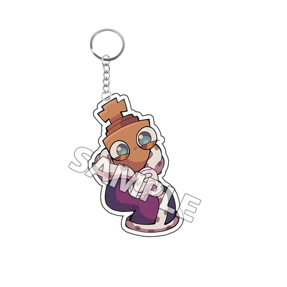 Acrylic keychain tadc cartoon character finished goods featuring a brown cartoonish character with large eyes and hat