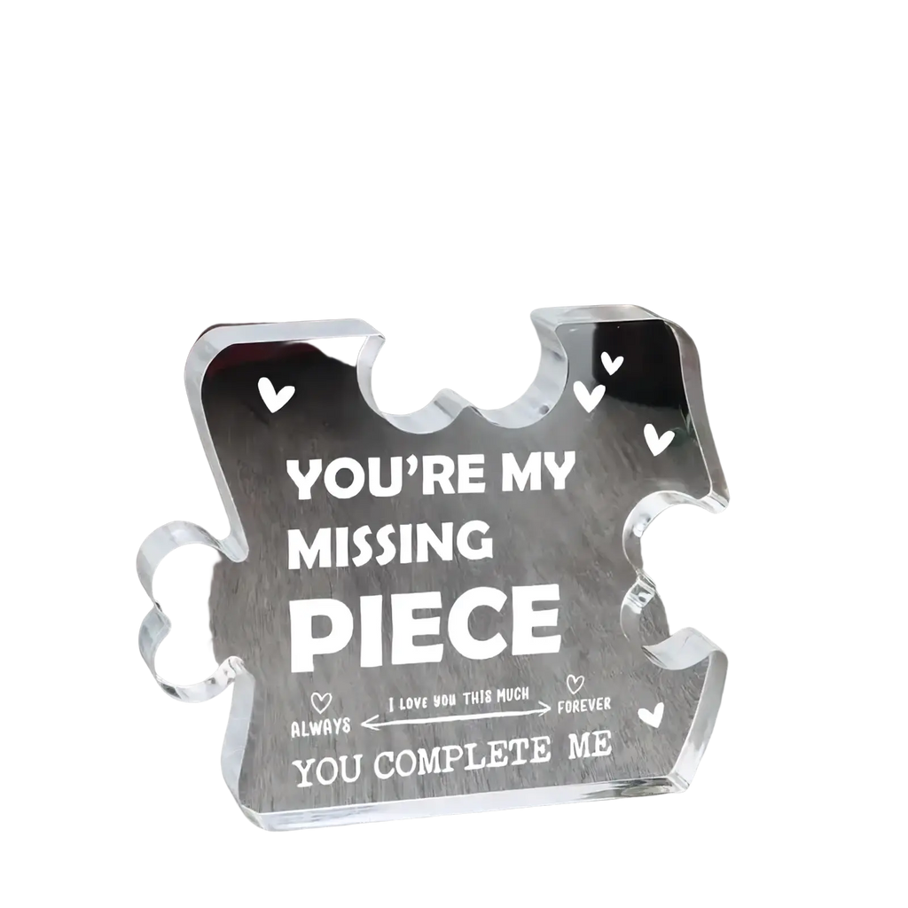 Clear acrylic puzzle piece plaque with engraved white text and hearts for couple keepsake gift