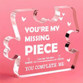 Pink acrylic puzzle piece couple keepsake gift plaque with white engraved text and heart designs