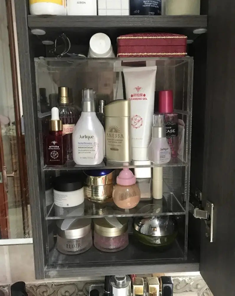 Clear acrylic dustproof stackable makeup organizer with multiple transparent shelves holding skincare and beauty products