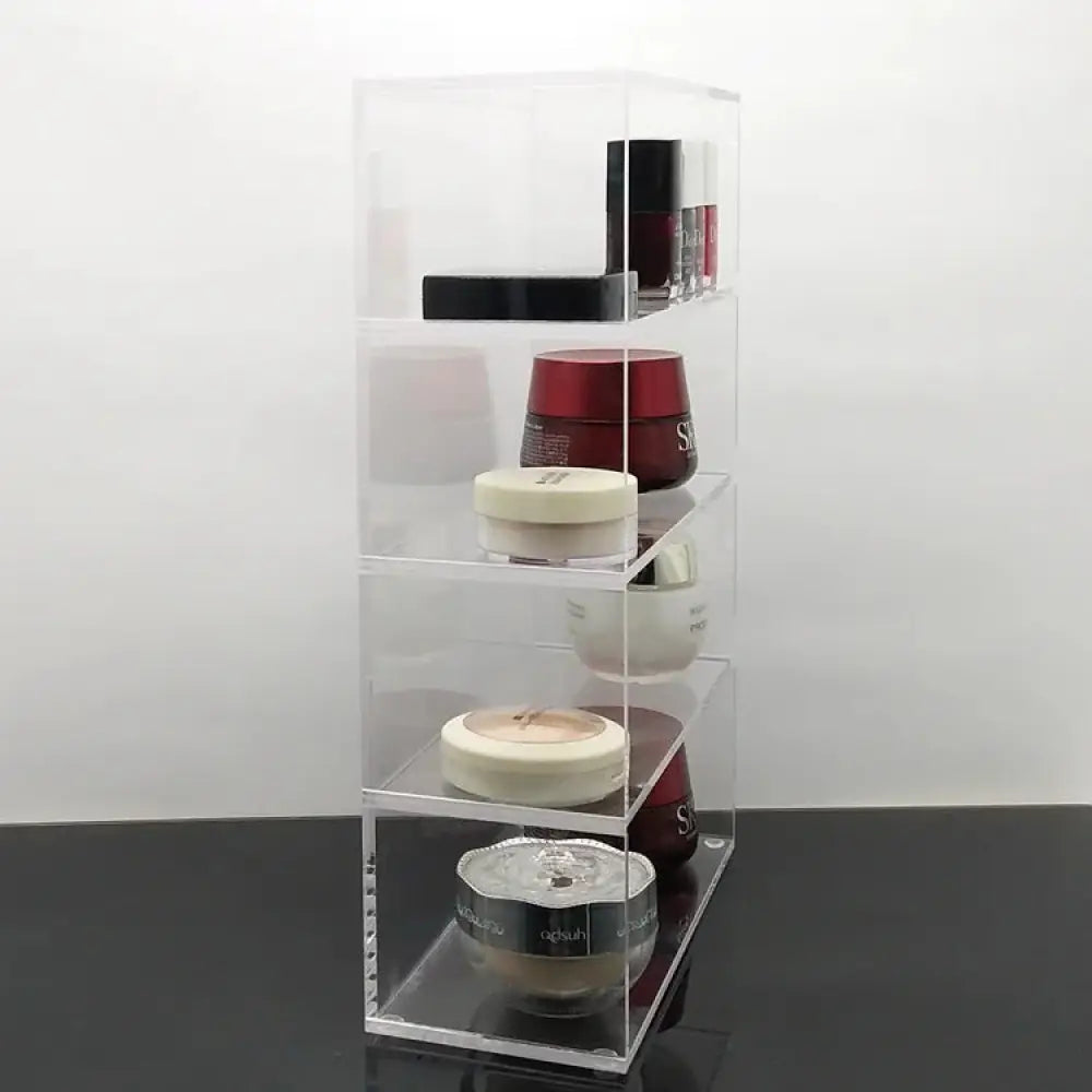 Clear acrylic four-tiered dustproof stackable makeup organizer designed for cosmetic storage and display