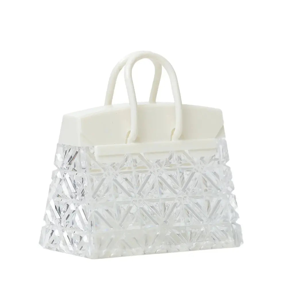 Crystal acrylic handbag night lamp with clear geometric pattern white handles and matching top flap with warm led glow