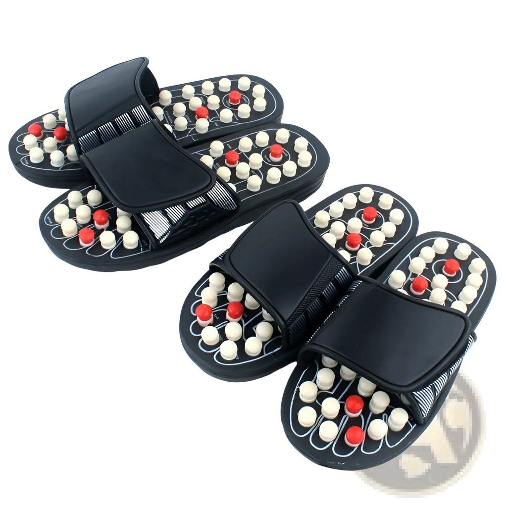 Black acupressure massage slippers for men and women with white and red spherical nodes on the soles