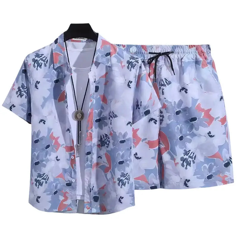 Light blue and coral floral print short-sleeved shirt and elastic waist shorts set featuring a retro tropical design.