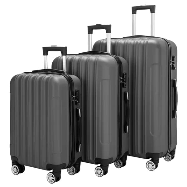 Set of three dark gray hard shell spinner suitcases with vertical ribbed design and silver wheels in a 3-in-1 luggage set.