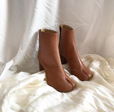 Tan leather ankle boots with a chunky high heel and distinctive split toe tabi seam design.