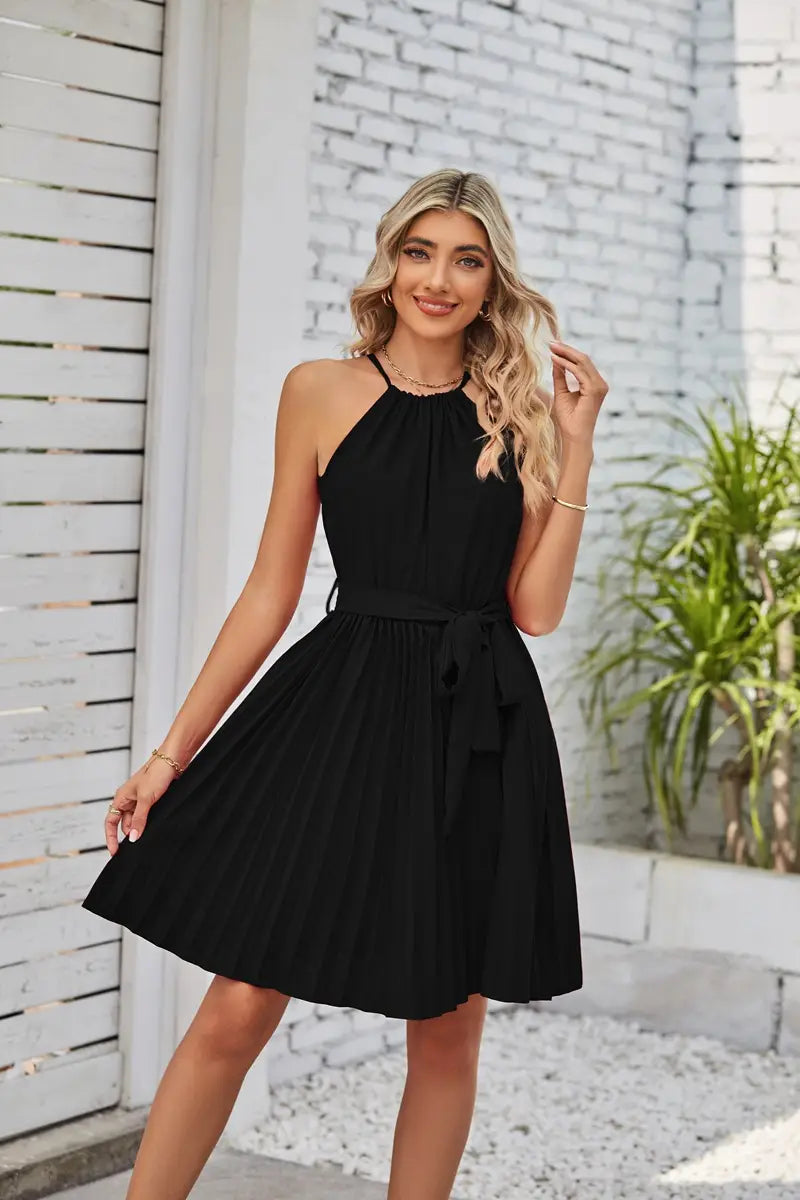 black halter neck pleated chiffon mini dress with tied waistband belt shown from the back side