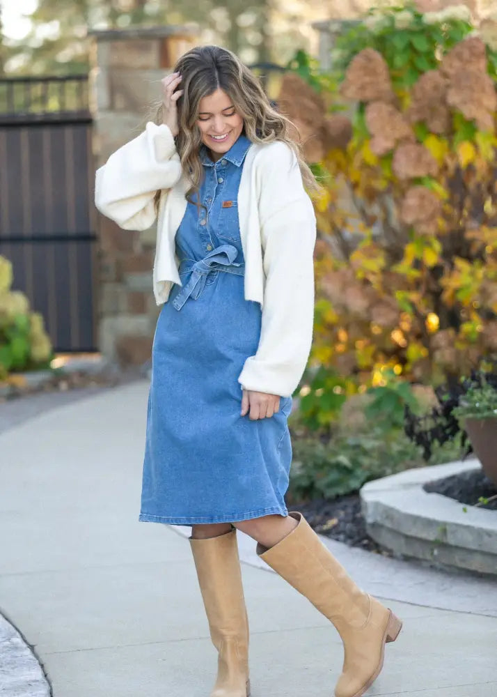 Ada denim button front midi dress featuring blue denim fabric with button-up front and tied waistband belt