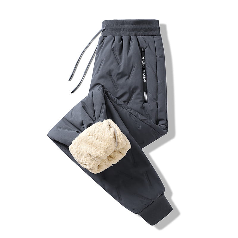 thermal fleece lined winter joggers in dark gray with plush beige fleece lining on cuffs and side pockets featuring an elastic waistband with drawstrings for added comfort and warmth.