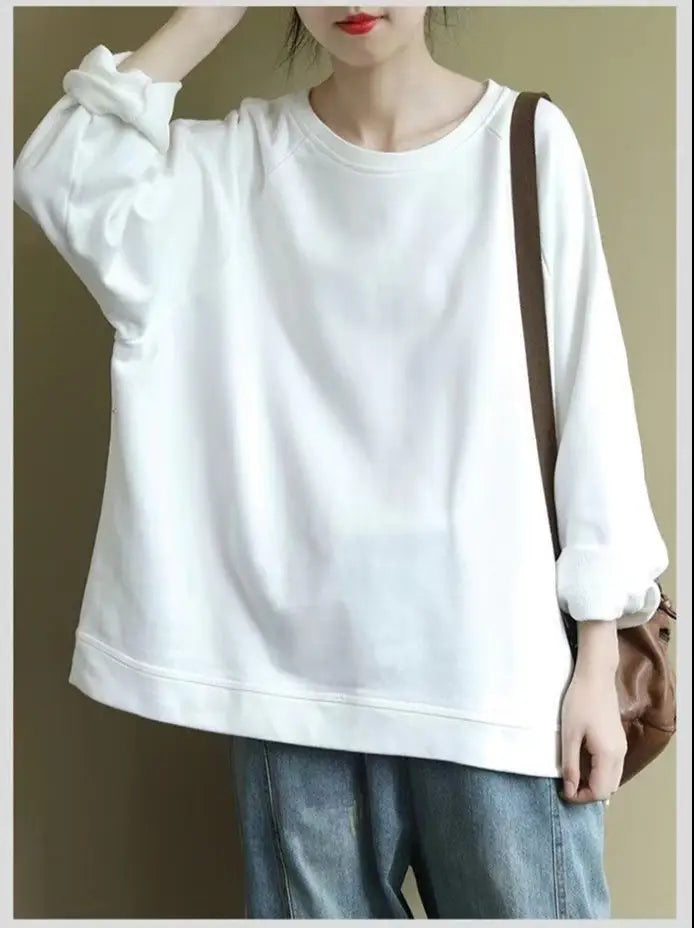 white oversized cotton blend pullover sweatshirt for women with a relaxed fit and rolled-up sleeves