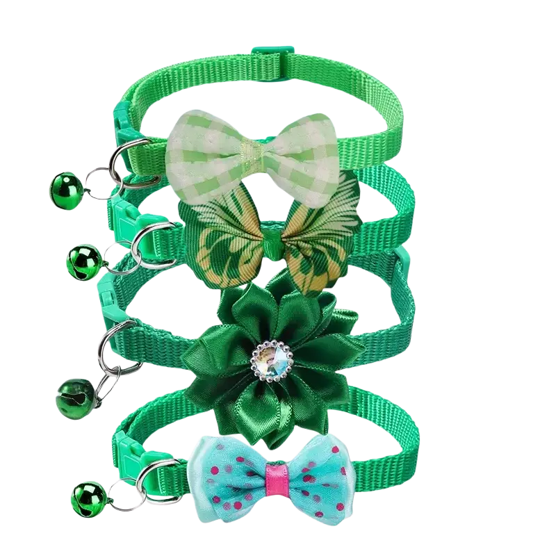 Set of four adjustable green bow cat collars with unique decorative bows and matching bells attached