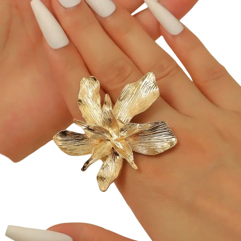Adjustable double layer flower ring in gold tone with textured petals worn on a finger
