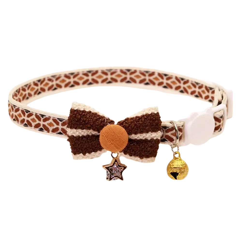 Adjustable length brown and cream floral cat collar with textured bow, orange button, star charm, and gold bell