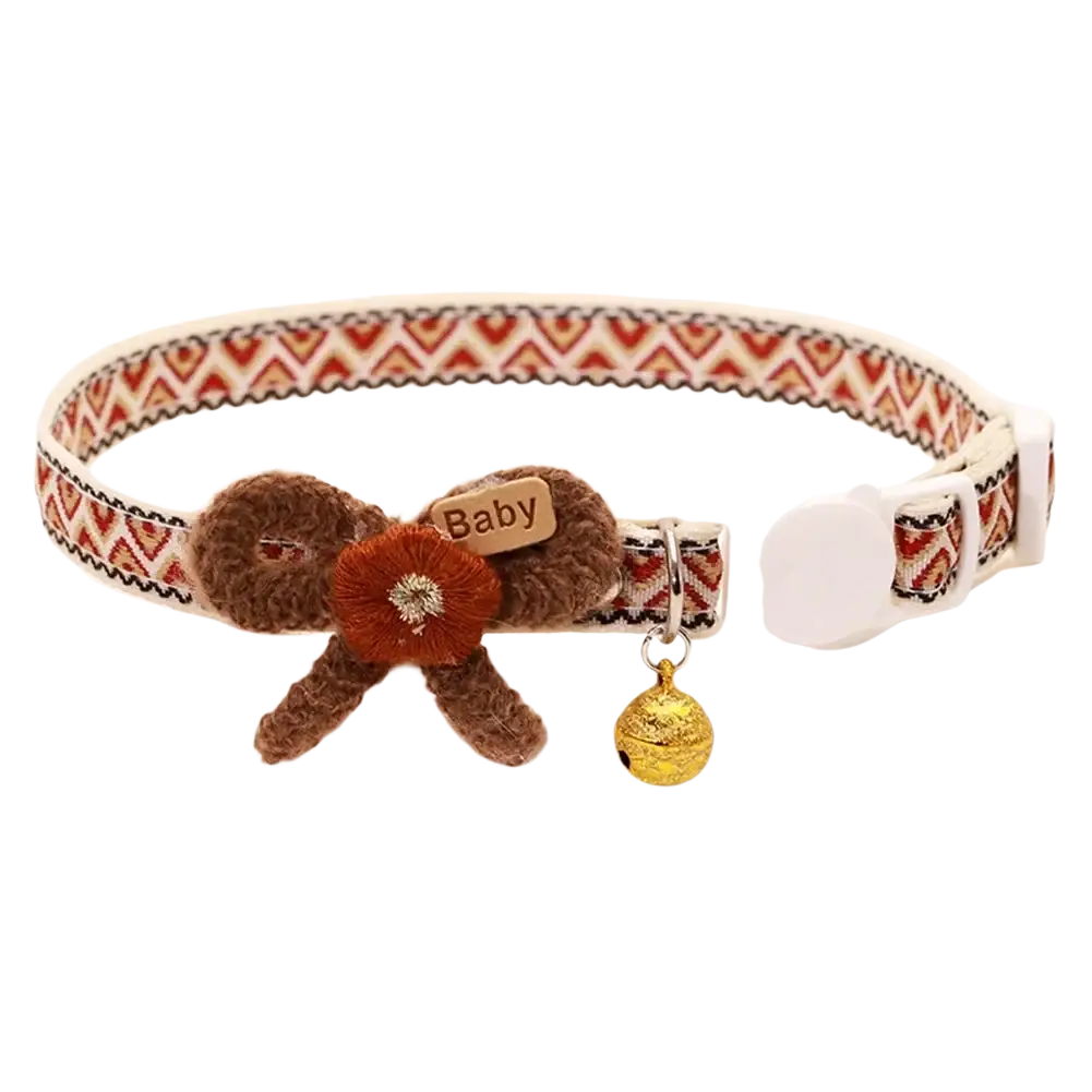 Adjustable length floral cat collar in brown and rust with plush bow, embroidered flower, and gold bell charm