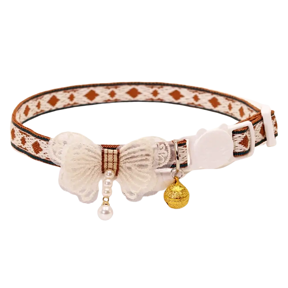 Adjustable length floral cat collar with cream lace bow, dangling pearls, gold bell, and brown geometric pattern