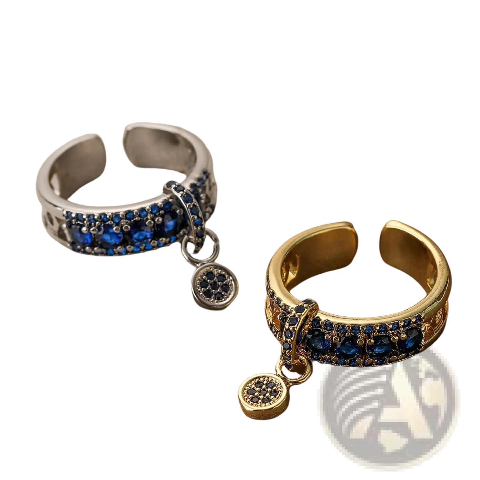 Two adjustable geometric open rings in gold and silver tones with blue zircon charms and deep blue gemstones