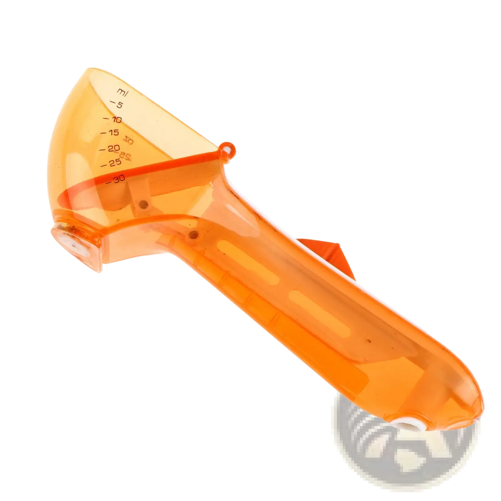 Transparent orange plastic measuring cup with milliliter markings from adjustable measuring spoon set with magnetic base