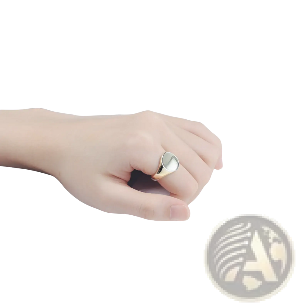 A sleek silver adjustable oval minimalist signet ring with a smooth face and polished metal band