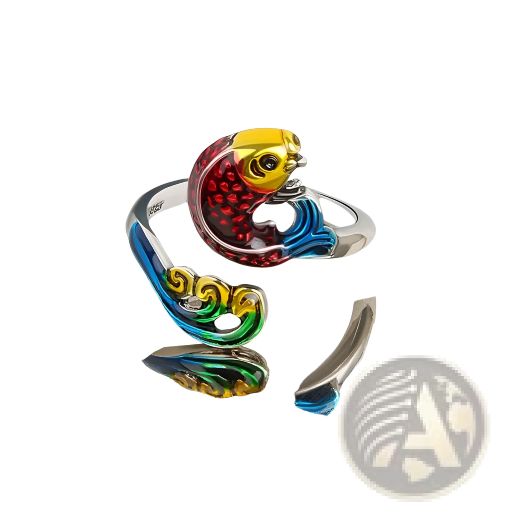 A vibrant adjustable fish-shaped ring with silver band and red yellow blue green enamel detailing for crochet tension