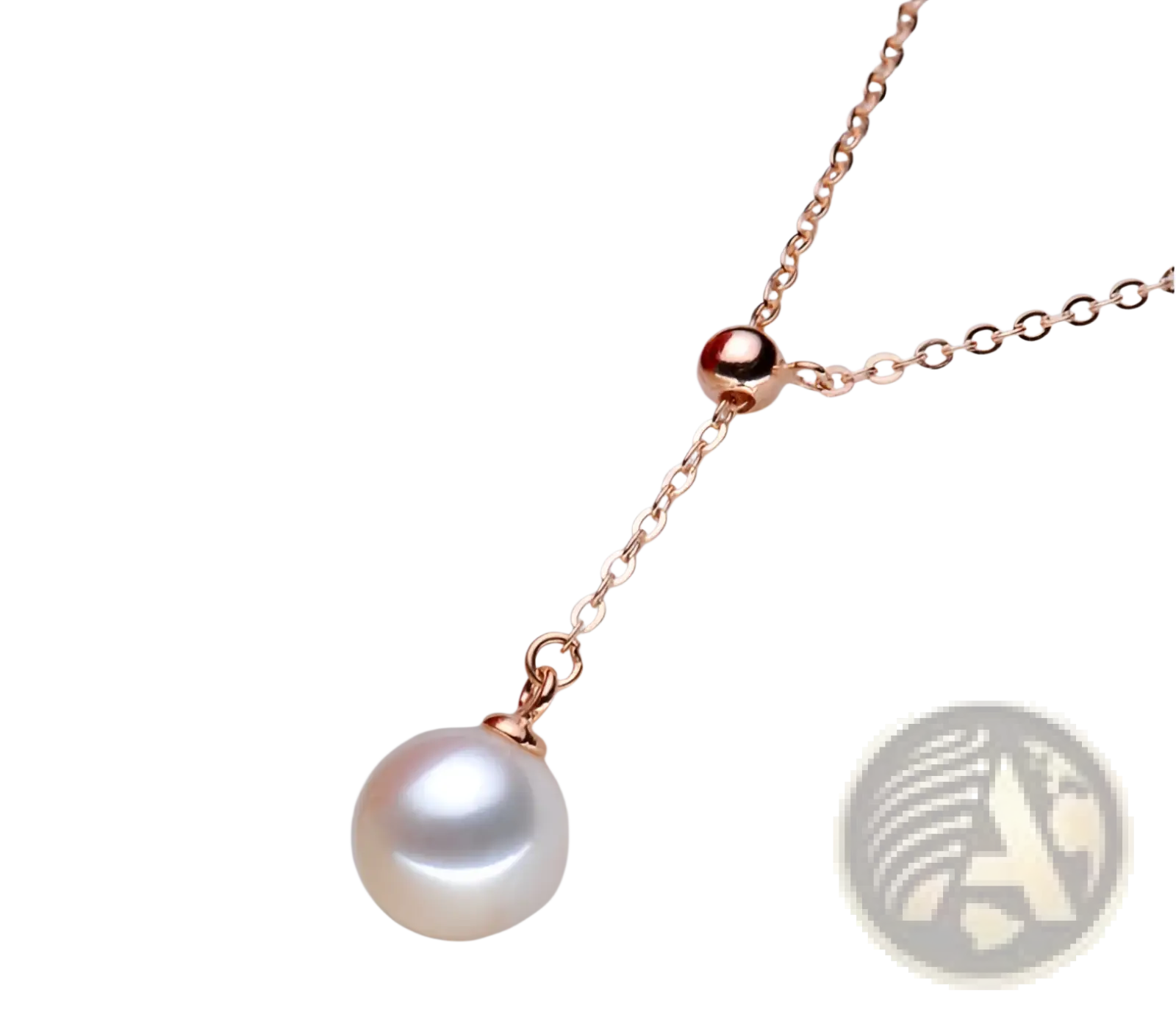 Adjustable pearl lariat necklace in rose gold with a lustrous white pearl and fine chain featuring a small spherical accent