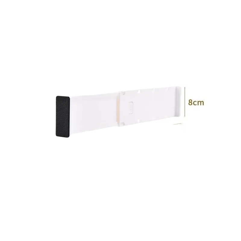 White plastic wall-mounted drawer organizer with black adhesive strip featuring free-combination design