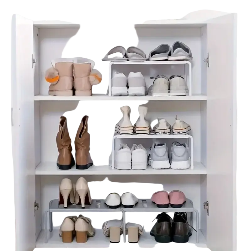 White metal adjustable plastic shoe rack with multiple tiers holding various pairs of shoes for organized storage
