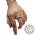 An adjustable silver ring for women featuring a delicate bow design adorned with sparkling crystals