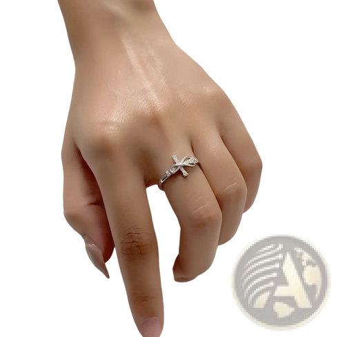An adjustable silver ring for women featuring a delicate bow design adorned with sparkling crystals