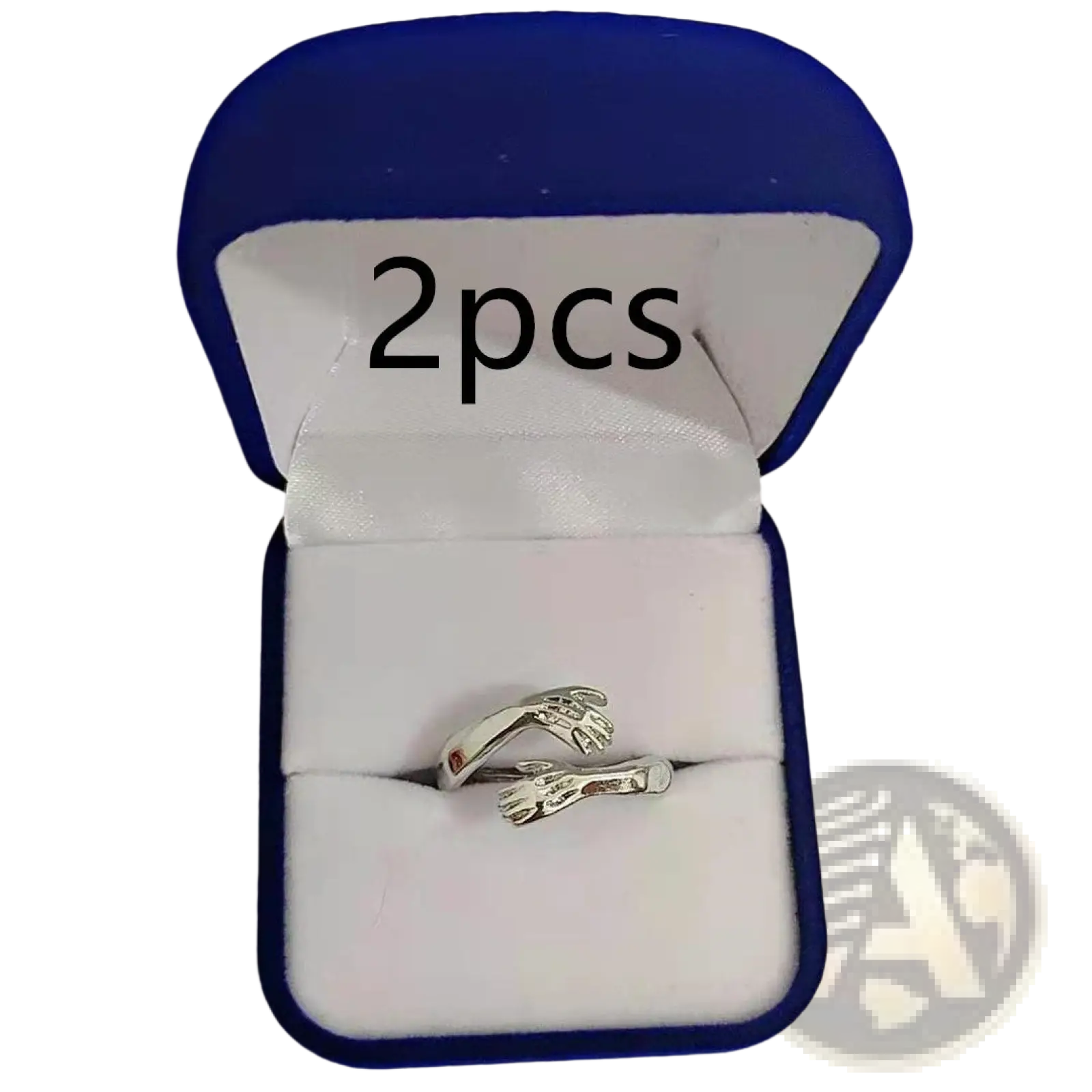 Adjustable silver ring featuring an intricate design of two hands embracing with a red gemstone centerpiece
