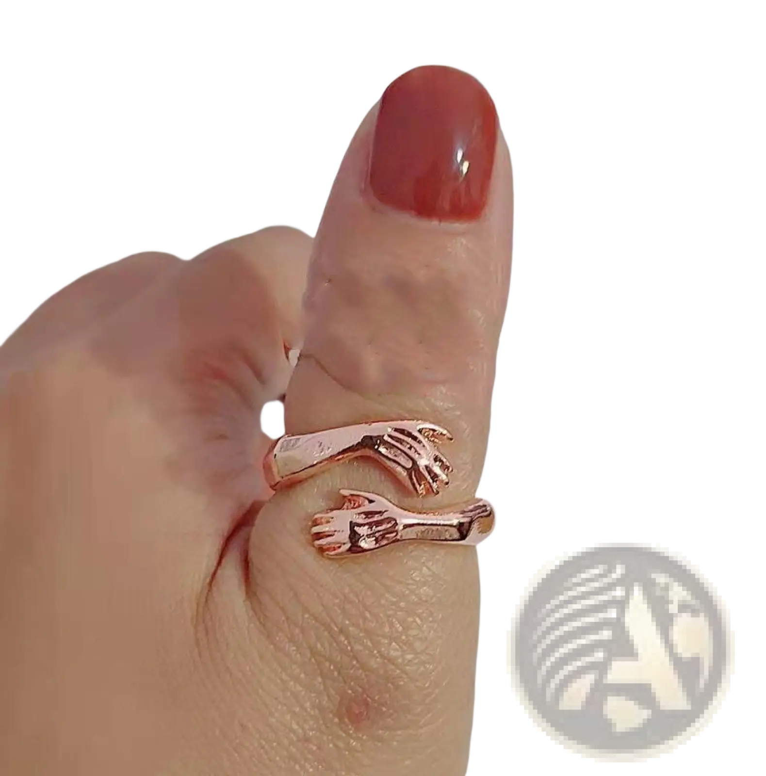 Adjustable rose gold ring with two interlocking hands design featuring a red gemstone in silver material