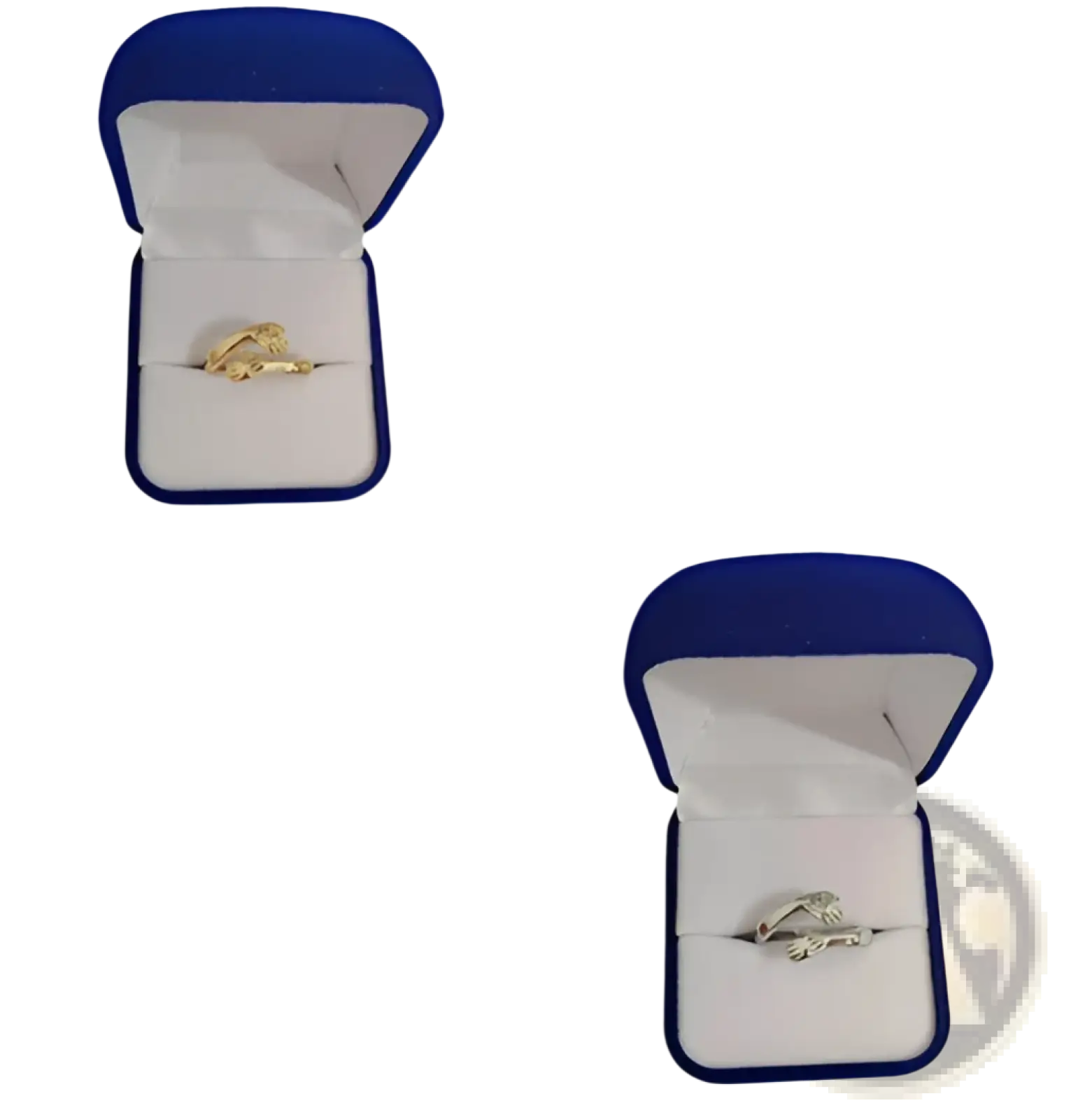 Gold and silver two-tone adjustable silver hands embracing ring set with red gemstone in blue velvet box