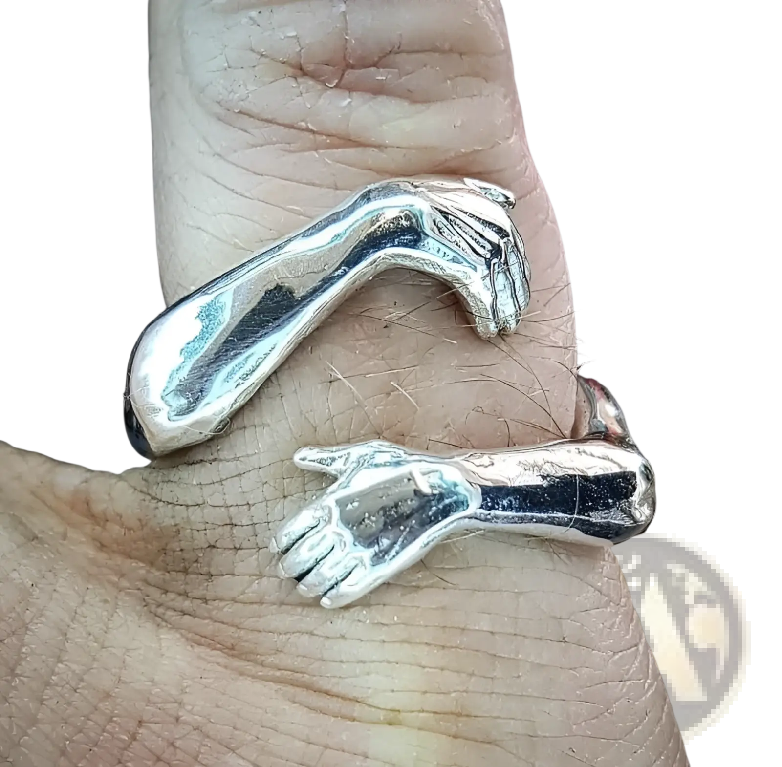 Adjustable silver embrace ring with two detailed hands clasping and a polished metallic finish with red gemstone