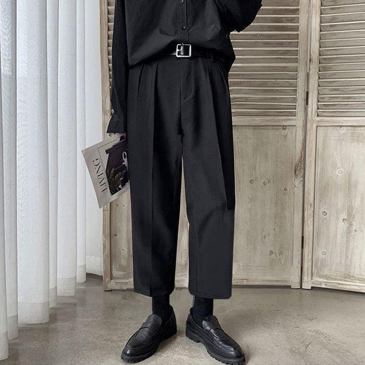 men loose fit straight leg suit pants in black featuring pleated detailing with a relaxed fit and cropped hem