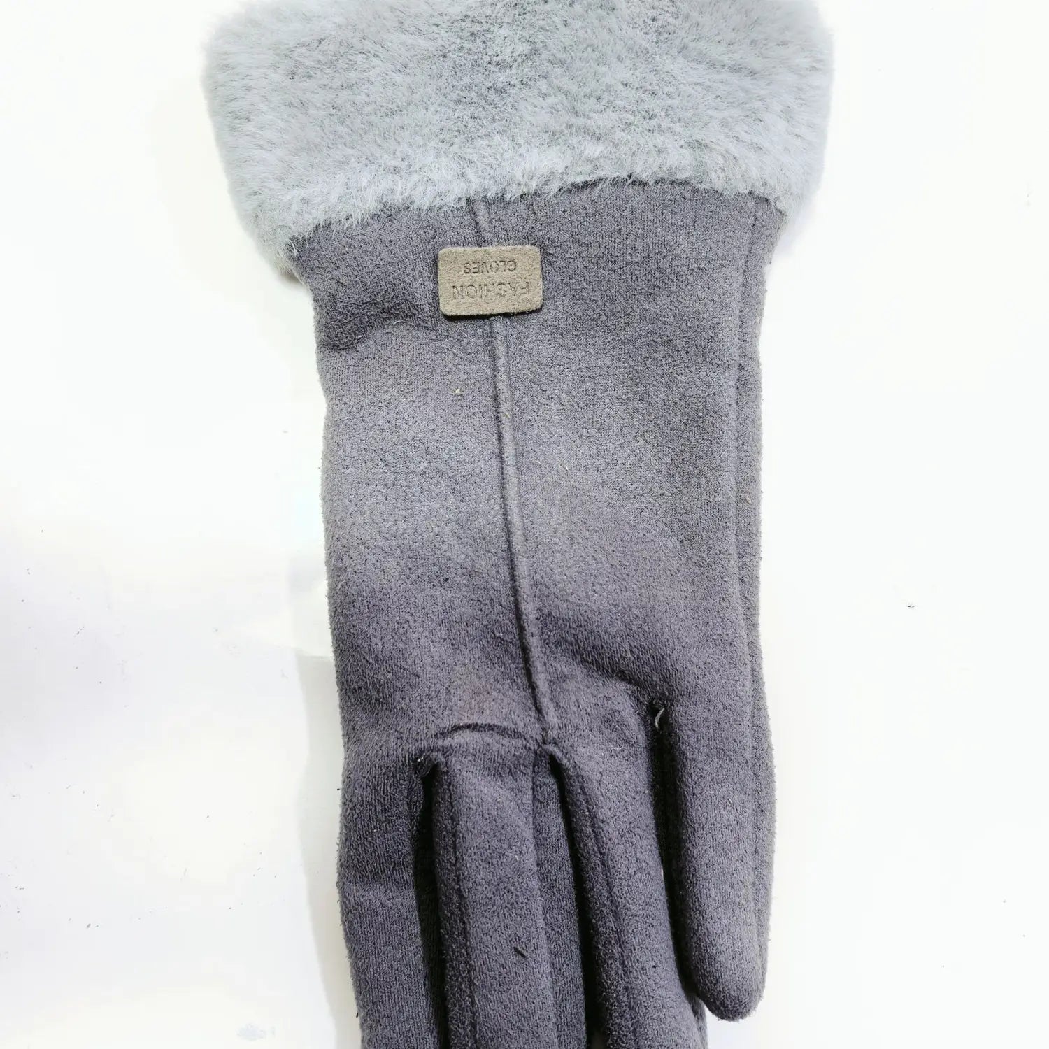 women’s thermal suede touchscreen glove in gray wool with a soft fluffy cuff and a small metallic brand tag visible on the back side