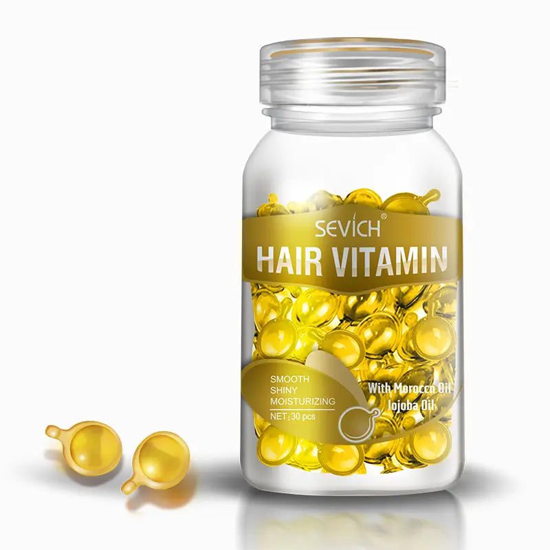 Frasco de vidrio transparente de cápsulas de vitamina para el cabello Sevich, que contiene cápsulas de gel doradas con pequeños tallos para la reparación y el brillo uniforme.