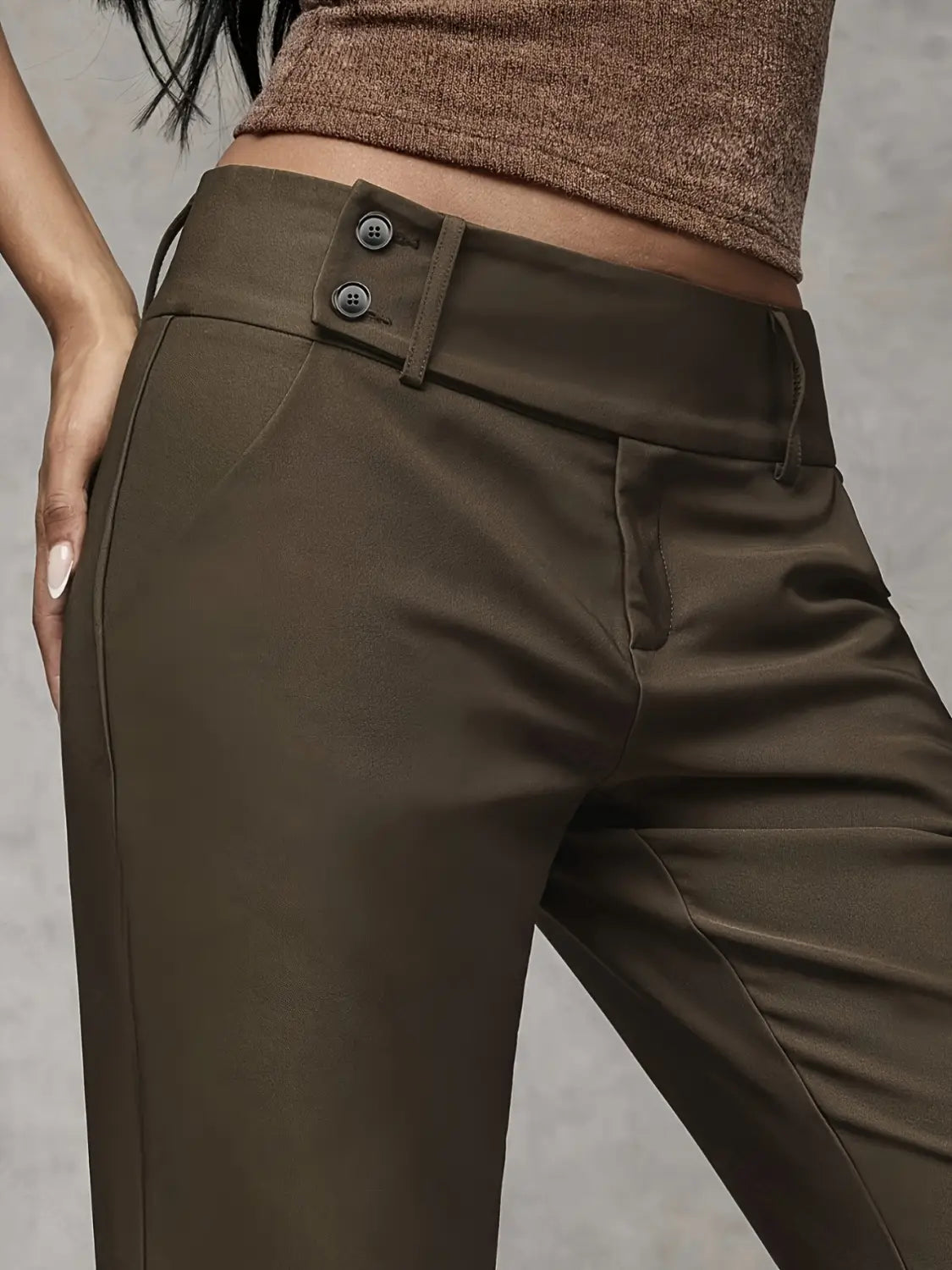 Olive green high-waisted wide leg work pants feature a sleek tailored fit with double-button closure at the waistband suitable for casual wear.