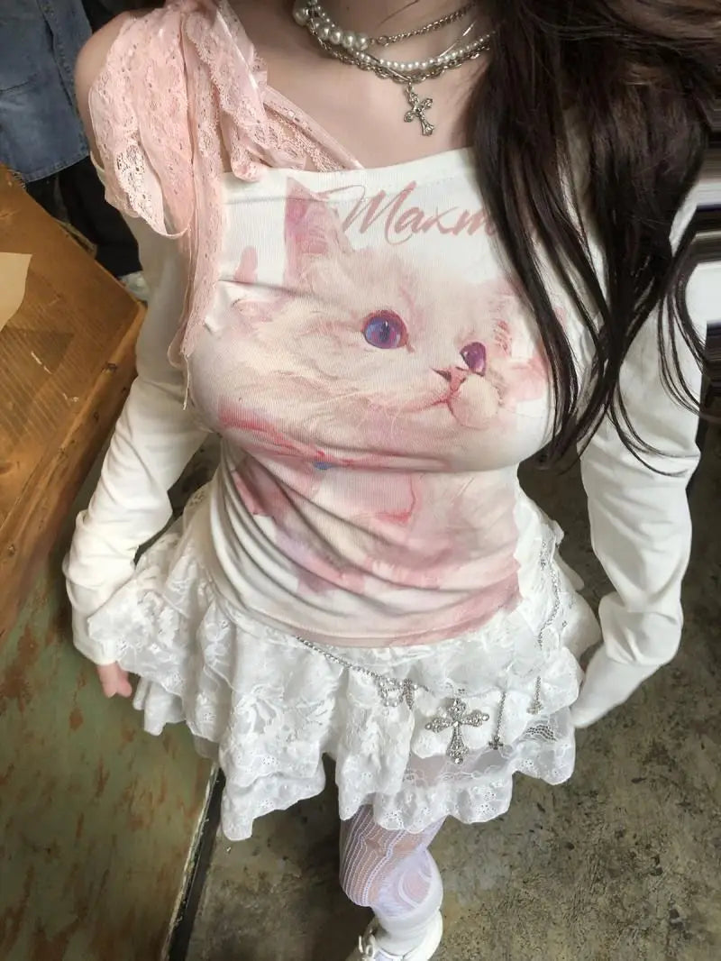 White long-sleeved top featuring a pink cat graphic and lace trim designed as a cat print lace halter long sleeve top.