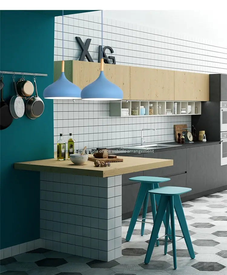 Blue Nordic Macaron LED pendant lights with wood accent fixtures hanging above a kitchen island.