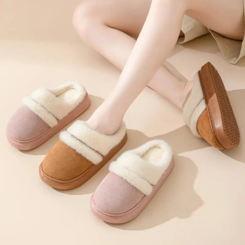 Soft pink and tan women’s plush suede house slippers with thick sole and fluffy white fur trim designed for winter use.